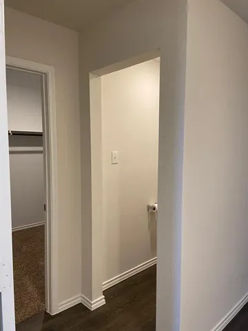 a view of front door with wooden floor