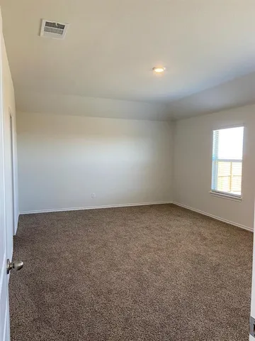 an empty room with a empty space and windows