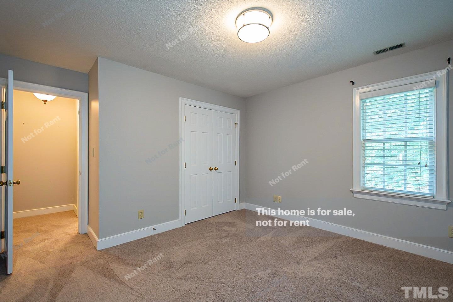 7904 Farnham Court Raleigh, NC 27615 - Photo 14 of 23 a view of an empty room with a window
