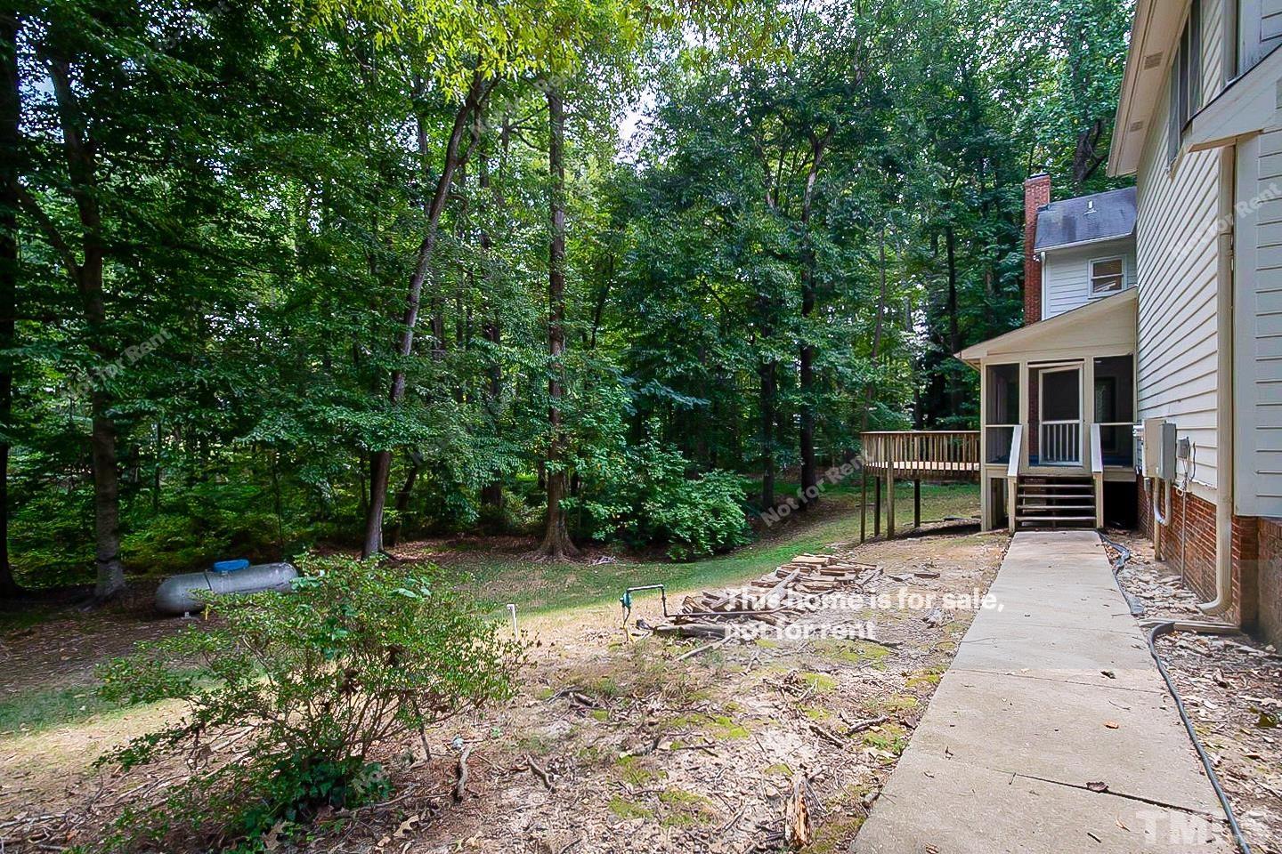 7904 Farnham Court Raleigh, NC 27615 - Photo 22 of 23 a view of house with backyard space and garden