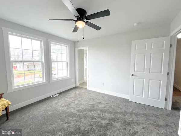 a view of an empty room with a window