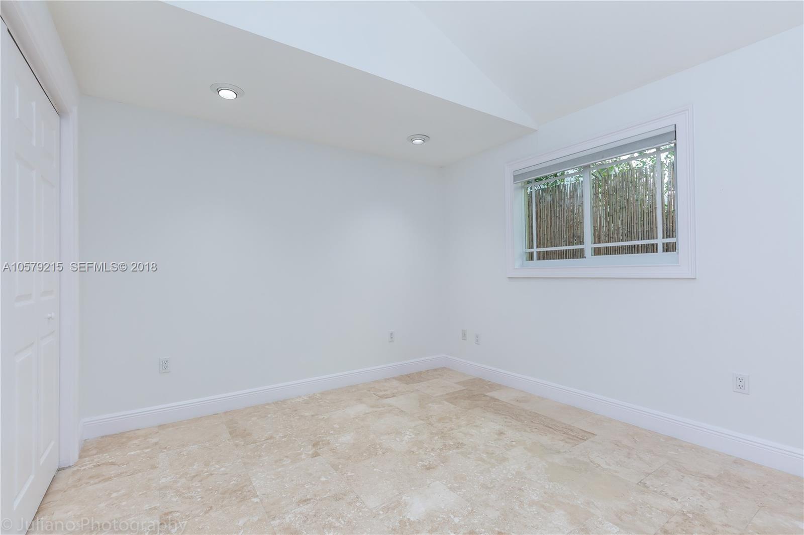 211 Southwest 29th Road Miami, FL 33129 - Photo 20 of 33 an empty room with a window