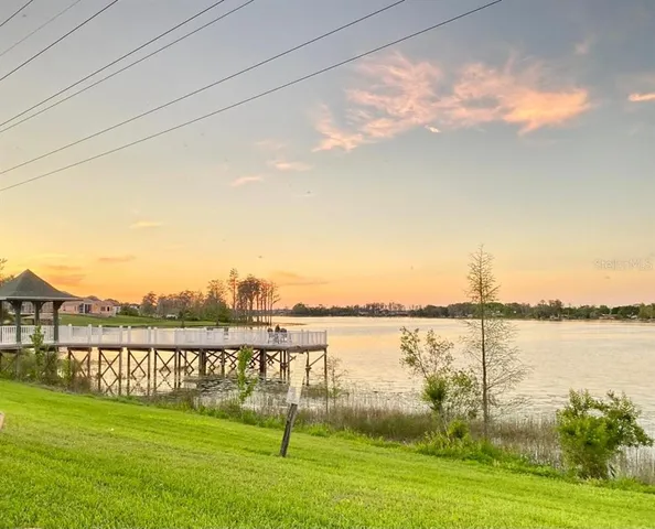 a view of a lake with a big yard