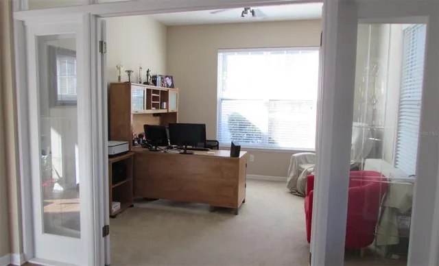 a living room with furniture and a window