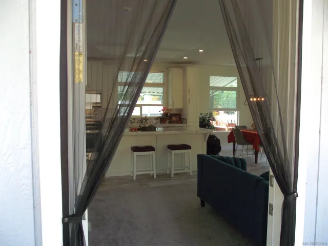 a bed room with a bed and a chandelier