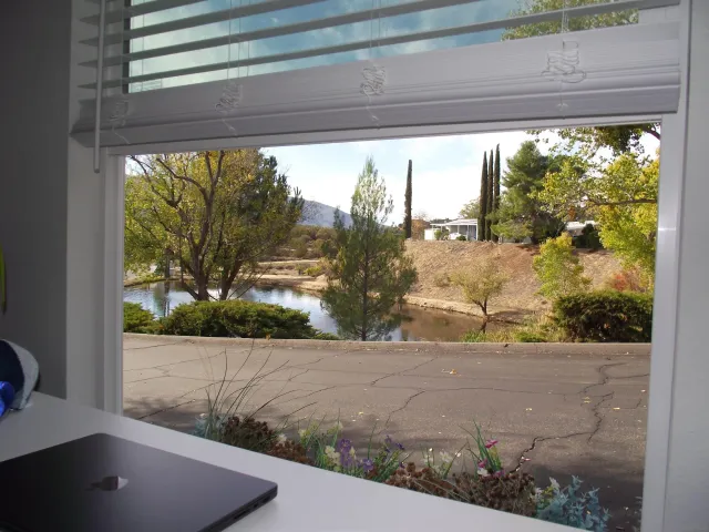 a bathroom with a granite countertop sink a large mirror and a