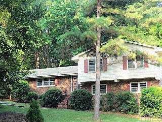 a view of outdoor space yard and front view of house