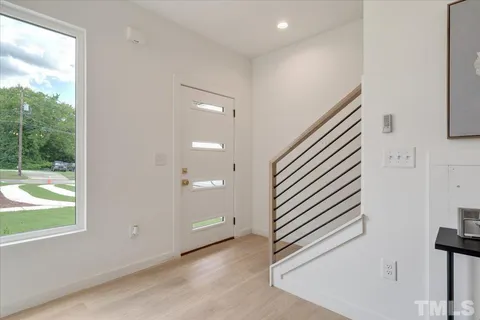 an entryway in a hall with a window