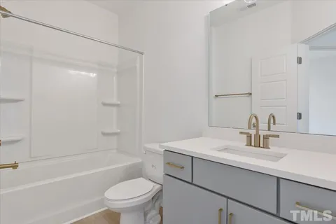 a bathroom with a sink a toilet and a bathtub
