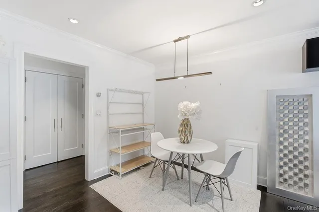 a view of a room with furniture and wooden floor