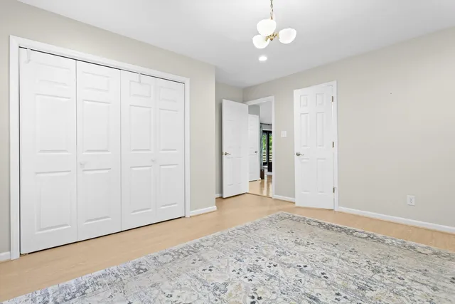 an empty room with a ceiling fan