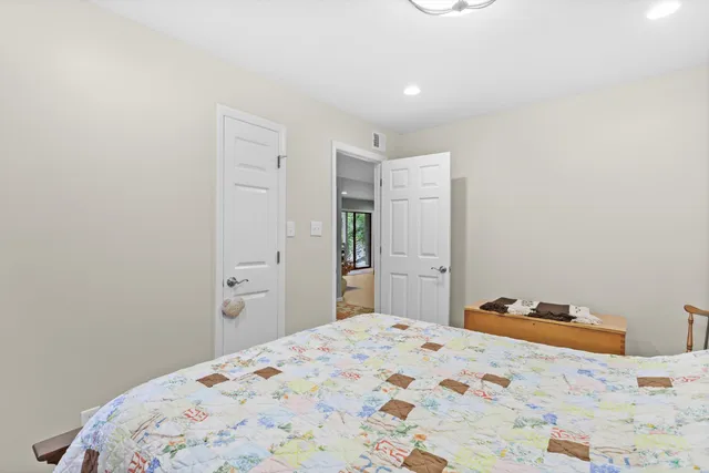 a bedroom with a bed and a cabinets