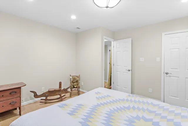 a bedroom with a bed and cabinets