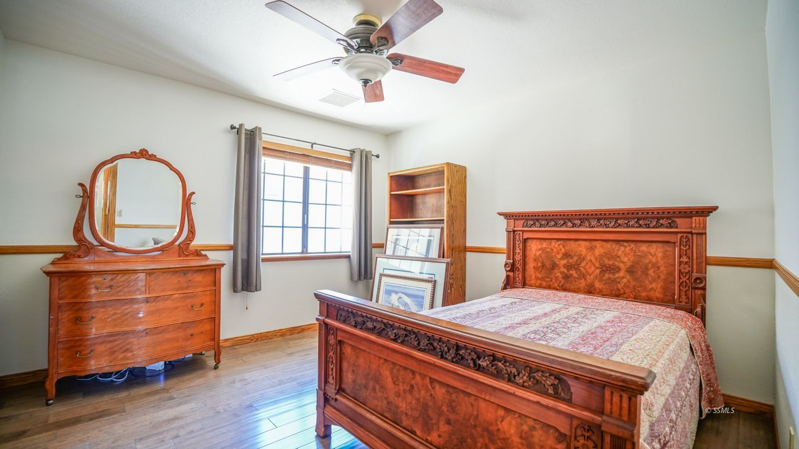 948 Hermosa Avenue Ridgecrest, CA 93555 - Photo 31 of 46 a bed room with a bed next to a window with closet