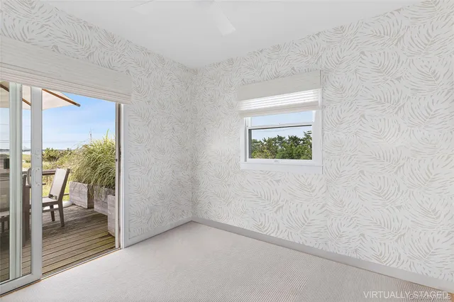 a view of a hallway with a room