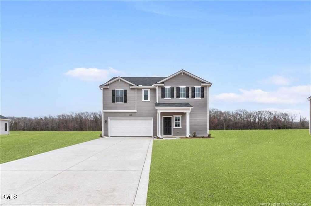 108 Rubyfield Court Fremont, NC 27830 - Photo 1 of 33 a front view of a house with a garden and yard