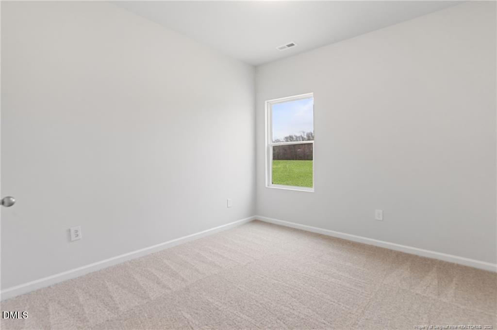 108 Rubyfield Court Fremont, NC 27830 - Photo 12 of 33 a view of an empty room with a window