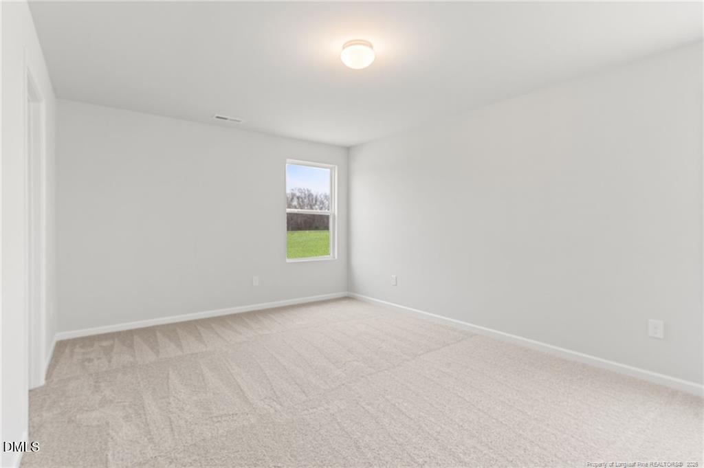 108 Rubyfield Court Fremont, NC 27830 - Photo 22 of 33 a view of an empty room with a window