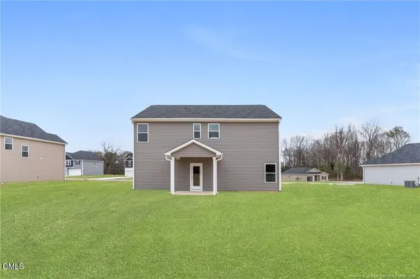 a front view of house with garden