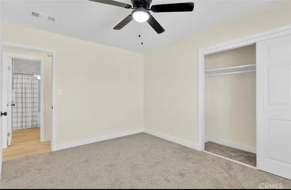 a view of room with ceiling fan
