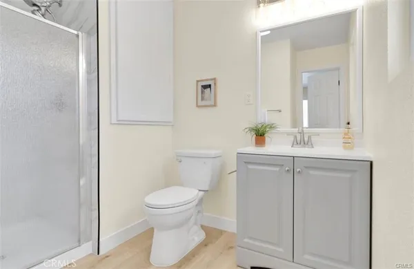 a bathroom with a sink toilet and a mirror