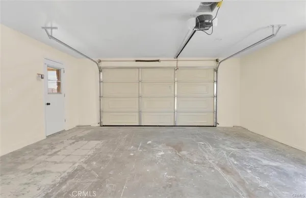 an empty room with white walls