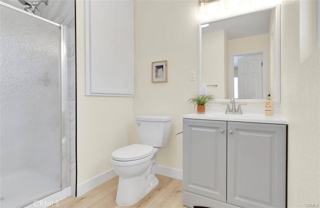 351 Armory Road Barstow, CA 92311 - Photo 19 of 35 a bathroom with a sink toilet and a mirror