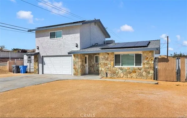a front view of a house with patio