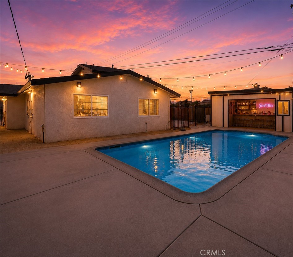 351 Armory Road Barstow, CA 92311 - Photo 2 of 35 a view of a swimming pool with an outdoor seating
