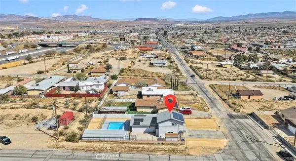 an aerial view of residential building and parking space