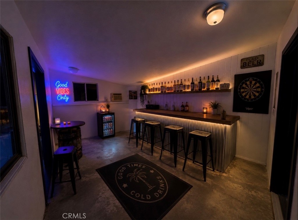 351 Armory Road Barstow, CA 92311 - Photo 27 of 35 a living room with furniture a flat screen tv and a fireplace