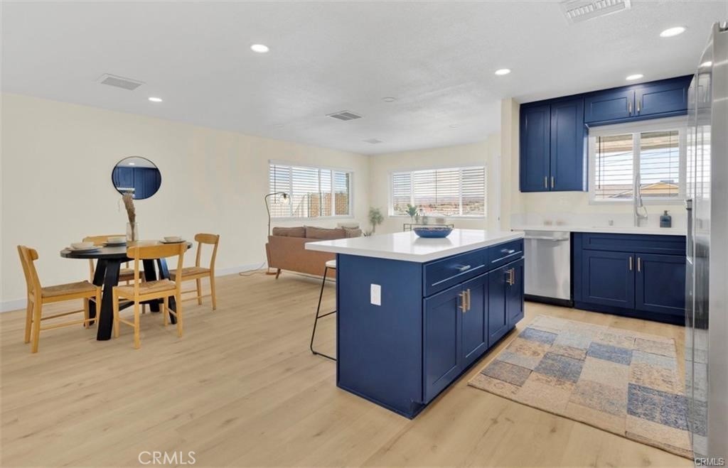 351 Armory Road Barstow, CA 92311 - Photo 7 of 31 a kitchen with stainless steel appliances granite countertop sink stove and cabinets
