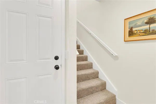 a view of staircase with white walls