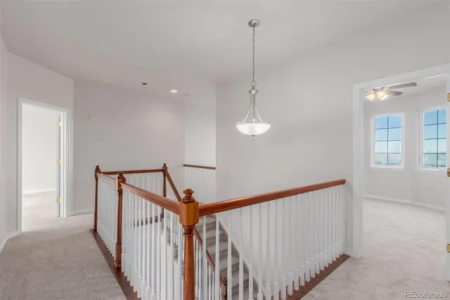 a view of a hallway view with staircase