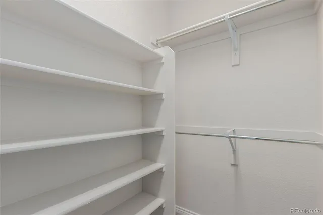 a view of an empty walk in closet