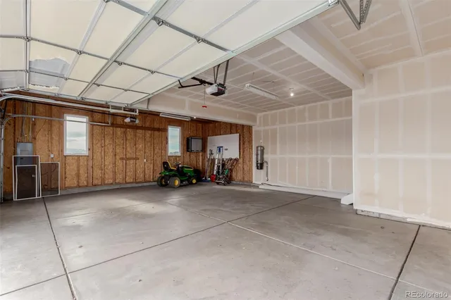 a view of empty room with wooden walls