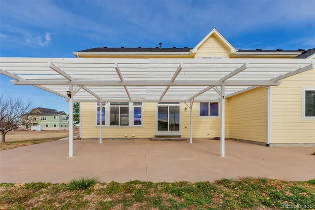 a view of a house with a snow in the yard