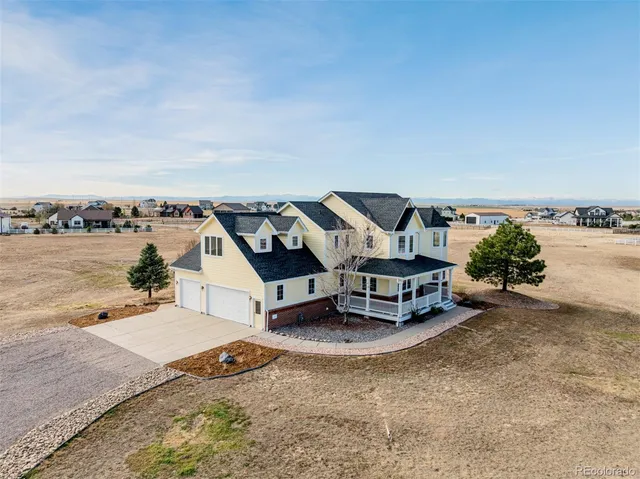 an aerial view of a house with outdoor space