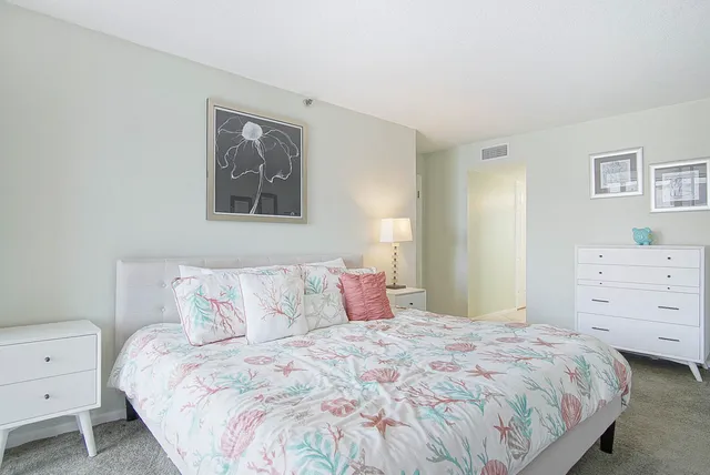 a bathroom with a granite countertop sink mirror and toilet