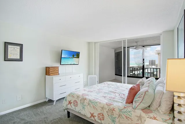 a bathroom with a toilet sink vanity and mirror