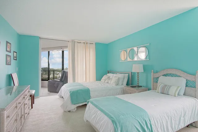 a bathroom with a toilet and a shower curtain