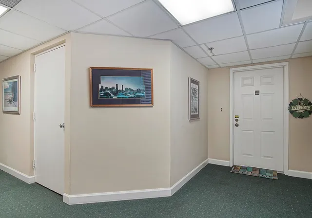 a living room with stainless steel appliances kitchen island granite countertop furniture and a view of kitchen