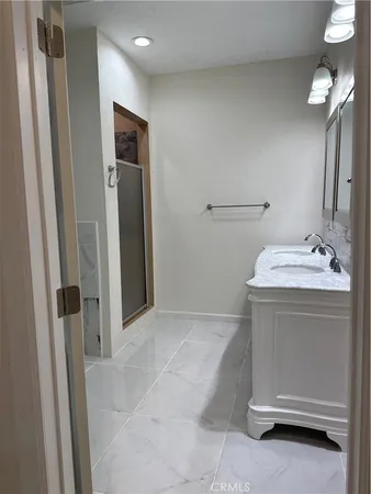 a bathroom with a sink and a mirror