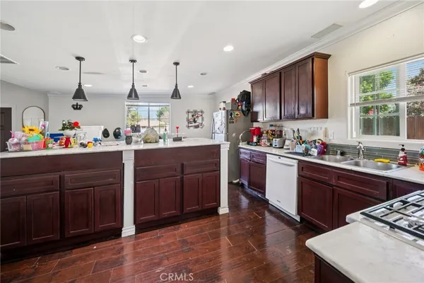 a kitchen with a sink stove and cabinets