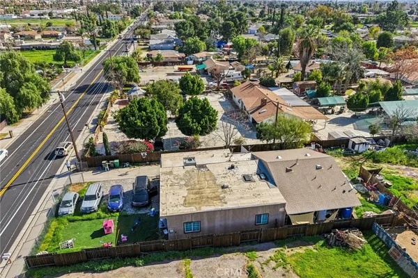 an aerial view of residential house with outdoor space and swimming pool