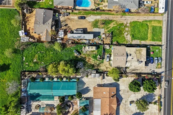 an aerial view of houses with yard