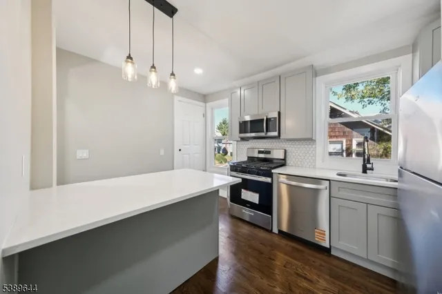 a bathroom with a toilet a sink and a shower