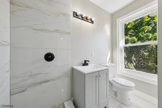 a bathroom with a toilet sink and bathtub