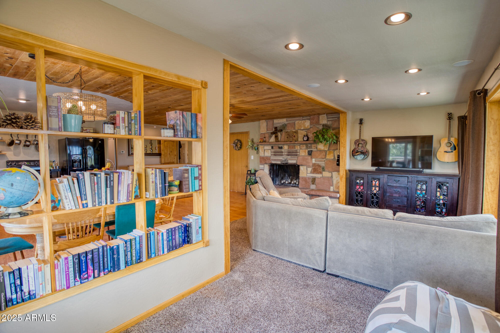 2611 Ellsworth Avenue Show Low, AZ 85901 - Photo 8 of 41 a living room with furniture and a flat screen tv