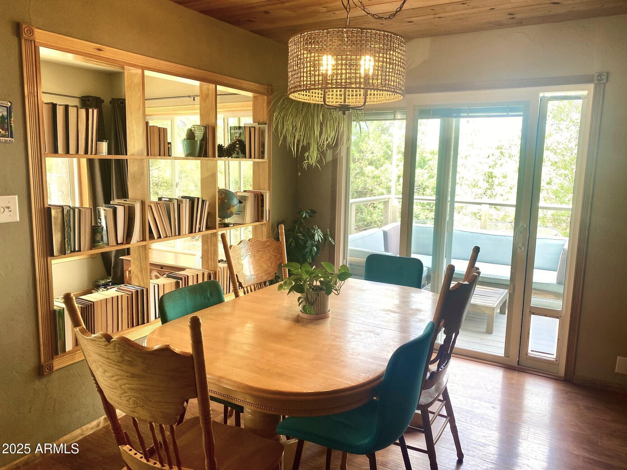 2611 Ellsworth Avenue Show Low, AZ 85901 - Photo 9 of 41 a view of a dining room with furniture window and wooden floor